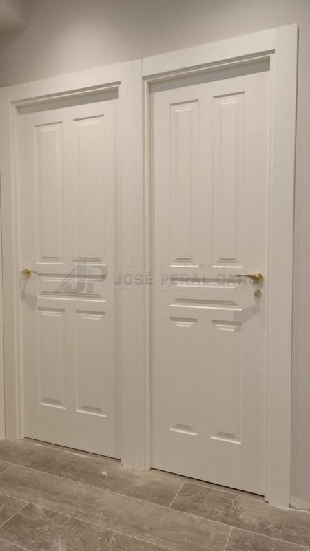 Trabajo realizado en Madrid: instalación de puertas de madera lacadas en blanco modelo 5 paños Trabajo realizado en Madrid: instalación de puertas de madera lacadas en blanco modelo 5 paños